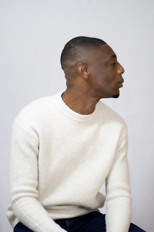 A Man Wearing Sweater Looking Sideways