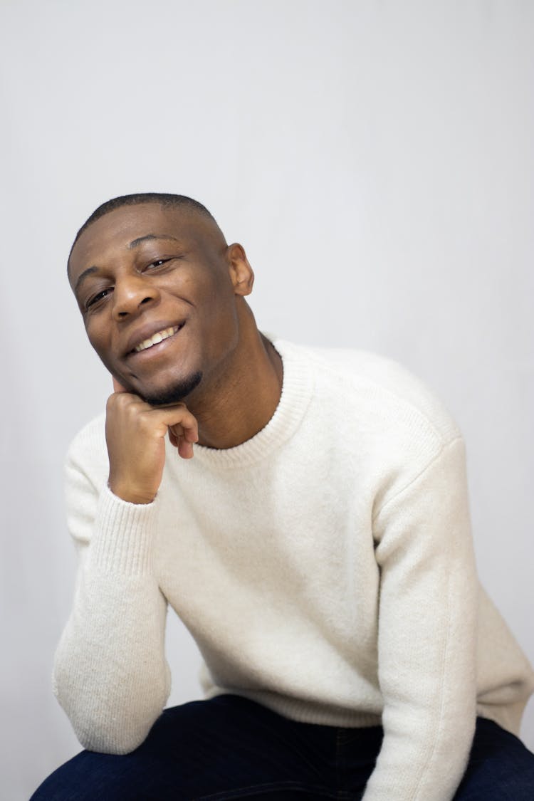 Man In White Sweater Smiling