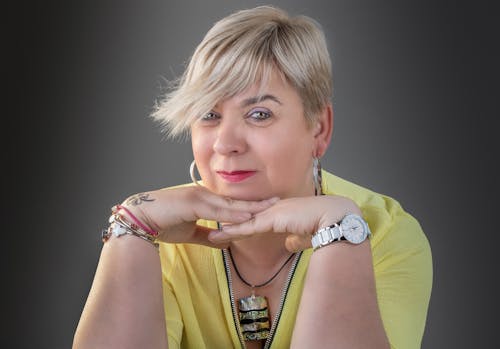 Woman with Blonde Hair Wearing a Yellow Shirt