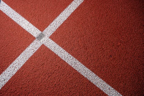 White Painted Cross o Red Surface