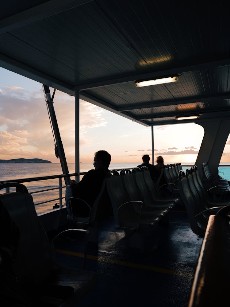 People Sitting On The Boat