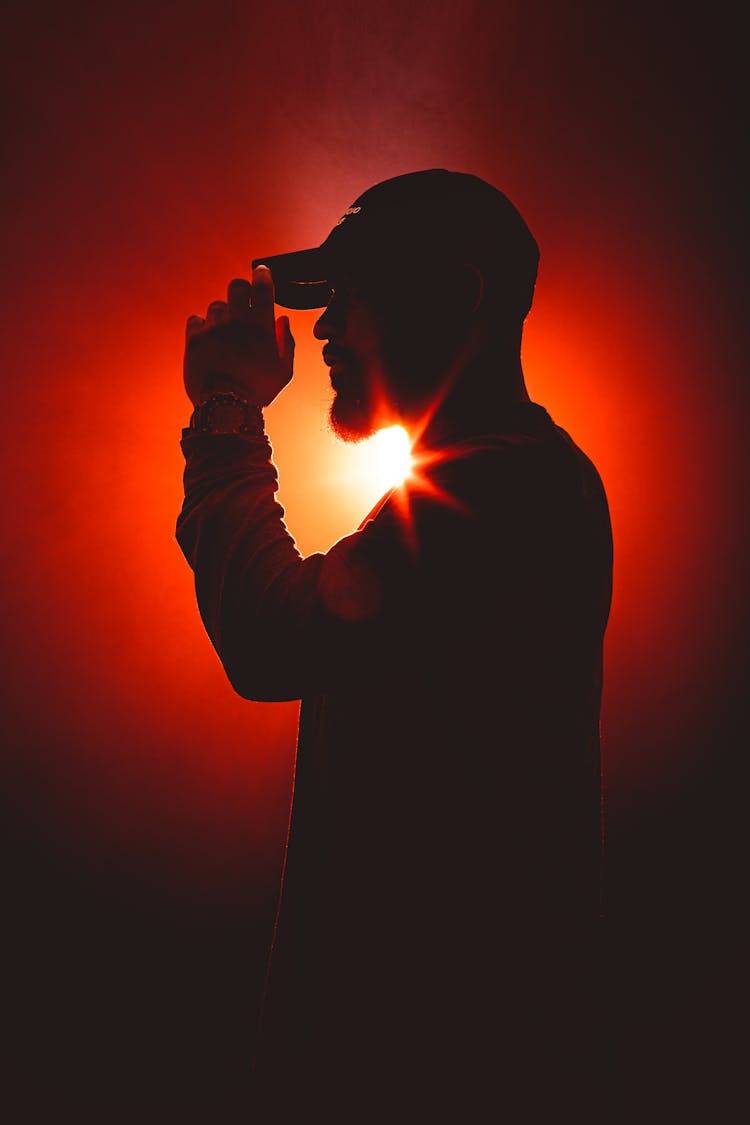 Silhouette Of A Man With A Cap