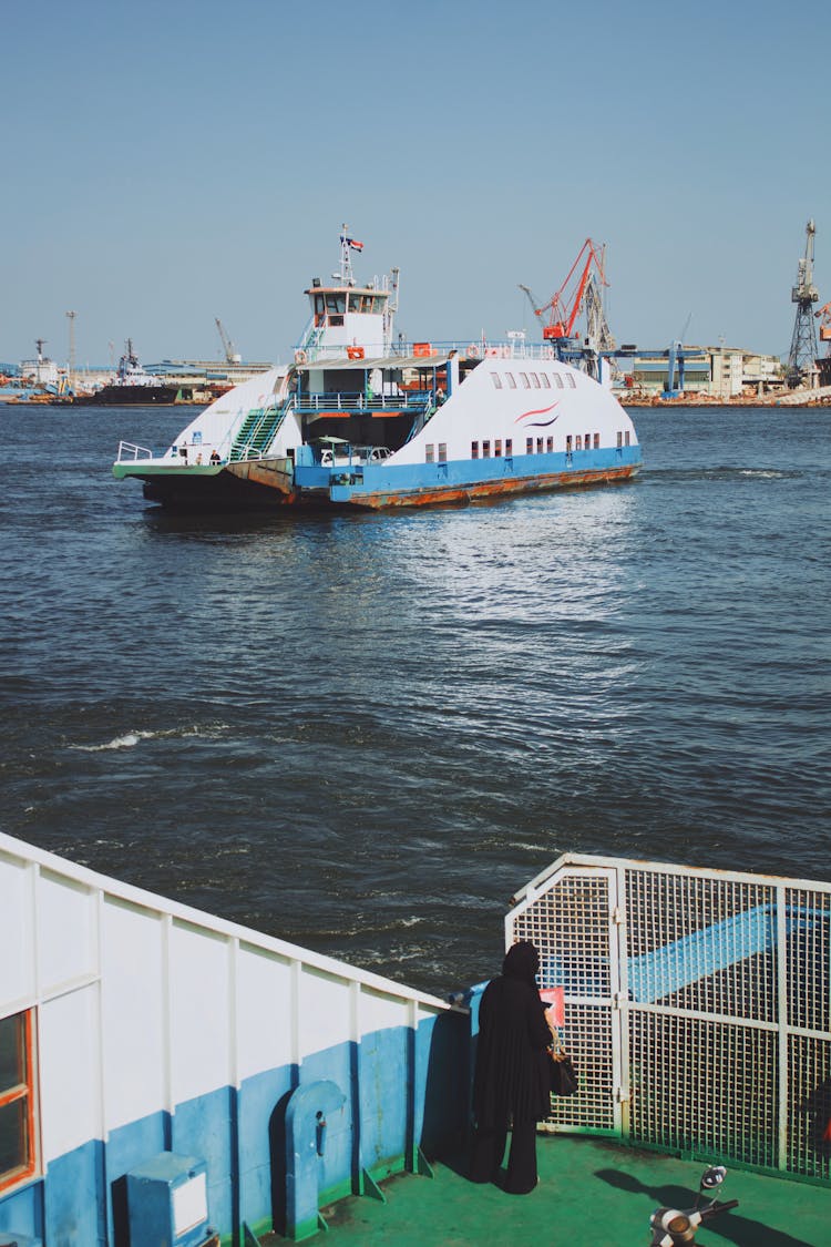 Ferry Boat Sailing In Water Near Port