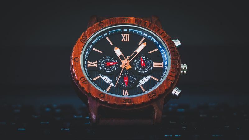 A colorful chronograph photographed on a dark surface — photo by George Zografidis on Pexels