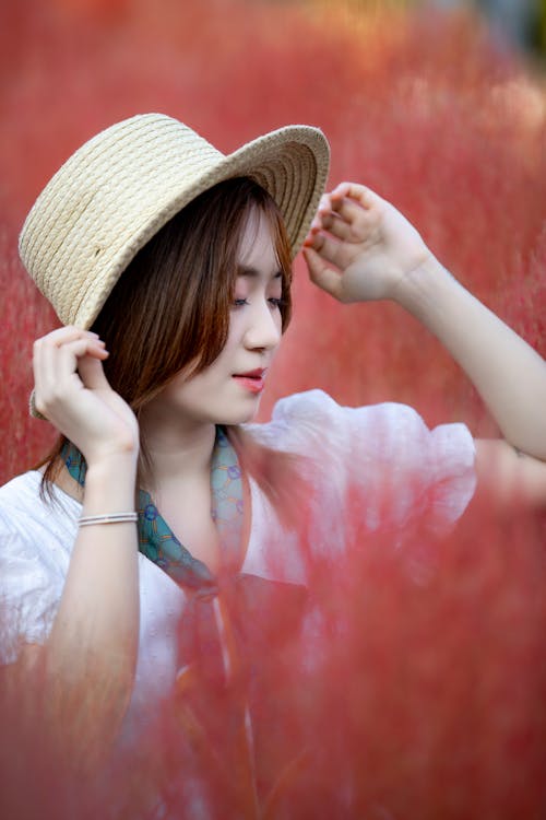 Free Woman in White Top Wearing Brown Straw Hat Stock Photo