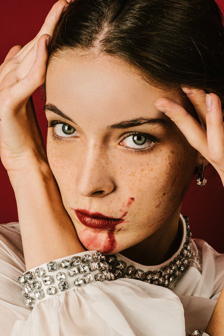 Portrait Of Woman With Lipstick Smeared On Face