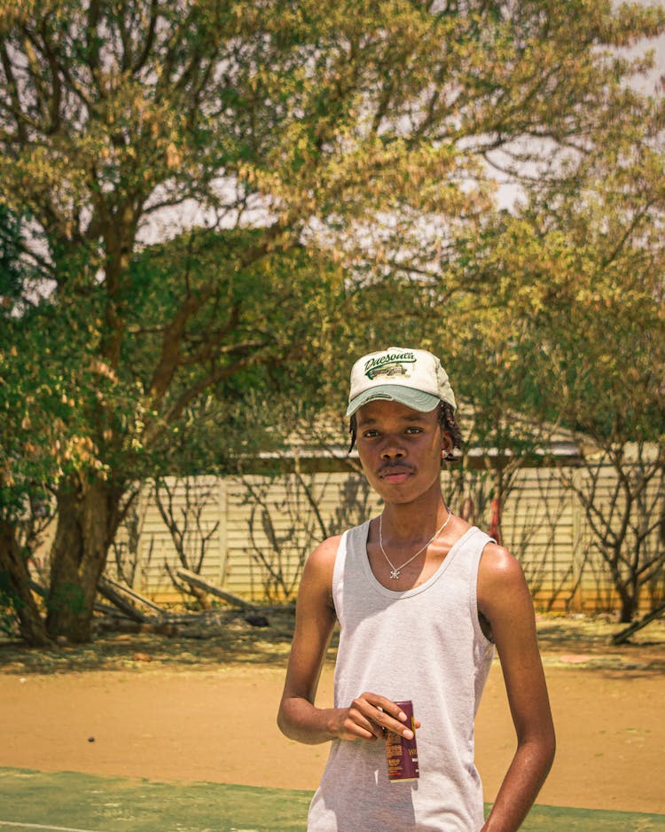 Teenager Boy Holding A Can