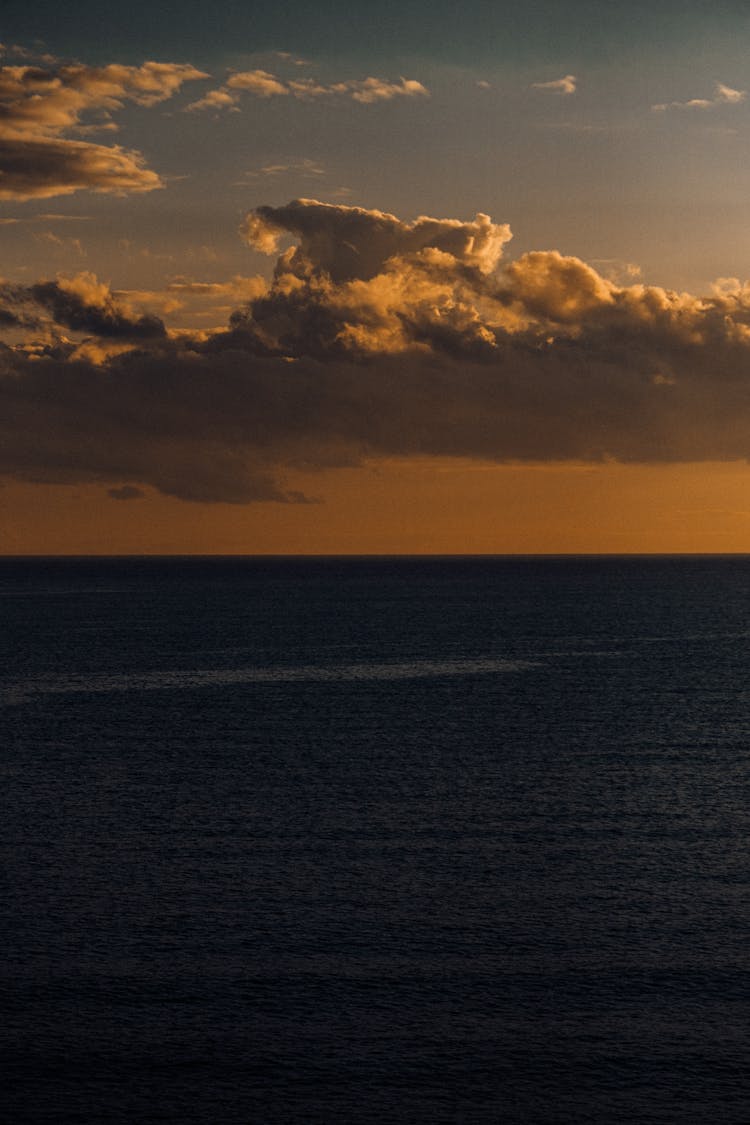 Cloud Over Sea Shore At Sunset