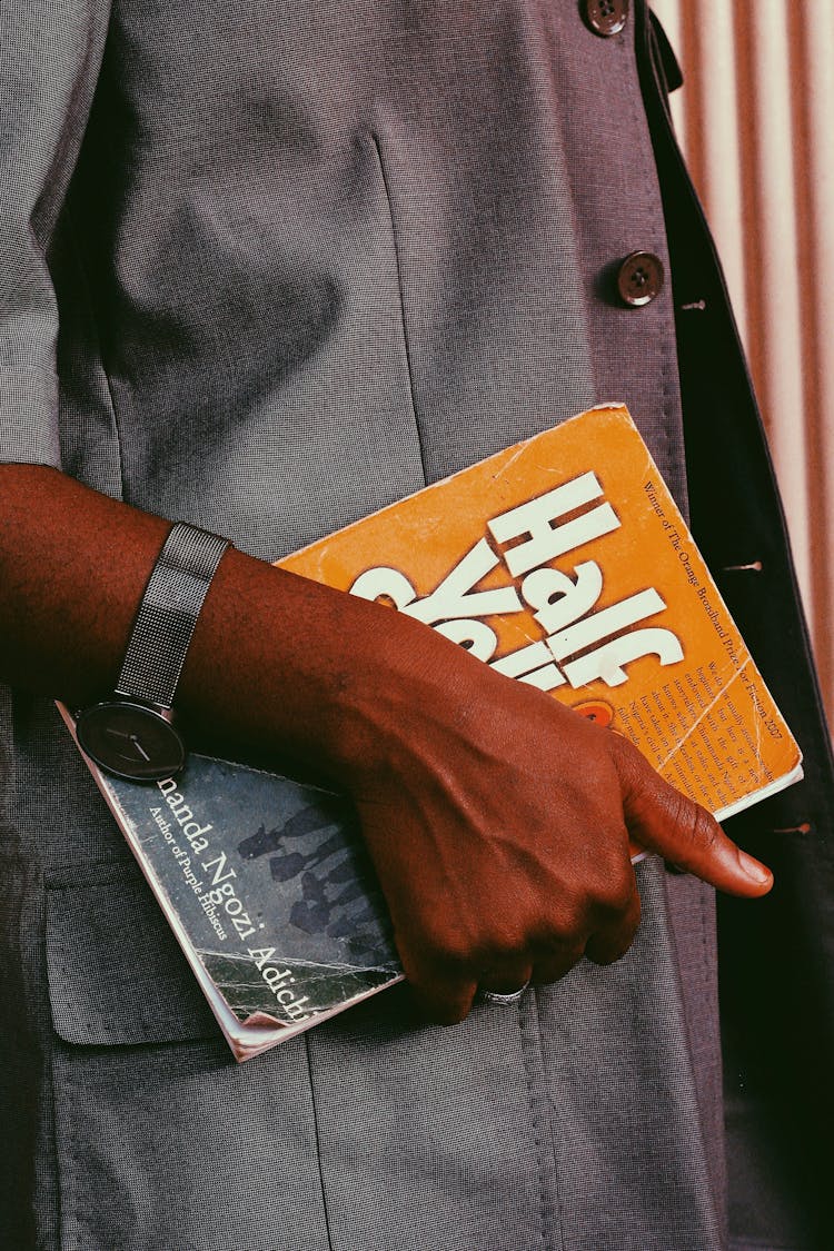 Close-up Of A Man Holding A Book 