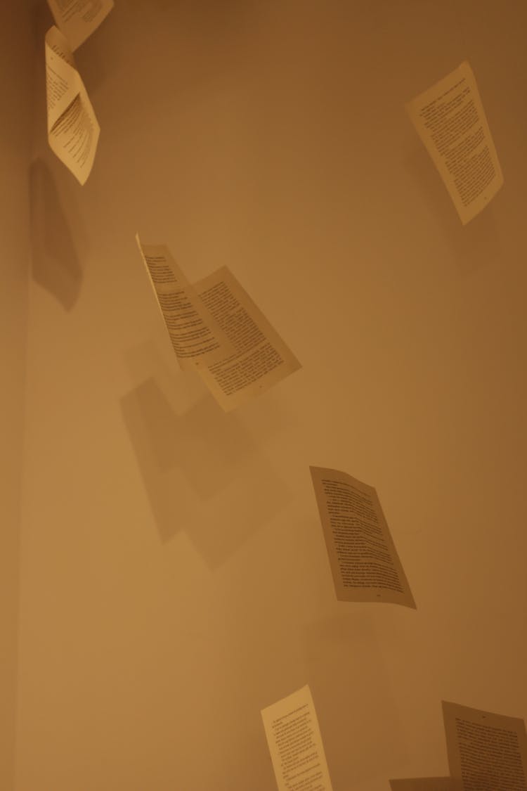 Close Up Of Flying Paper Sheets