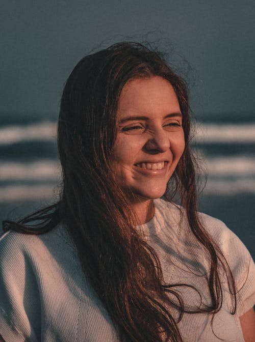 A Smiling Woman on the Beach