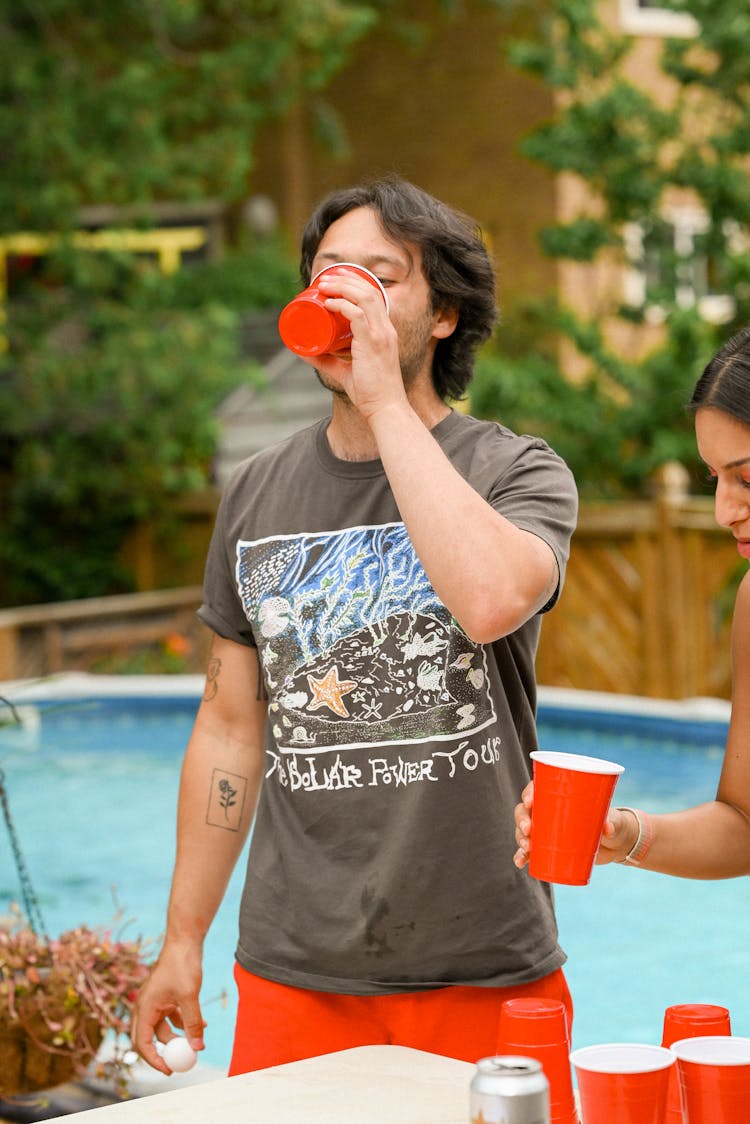 Boy Drinking From Red Solo Cup