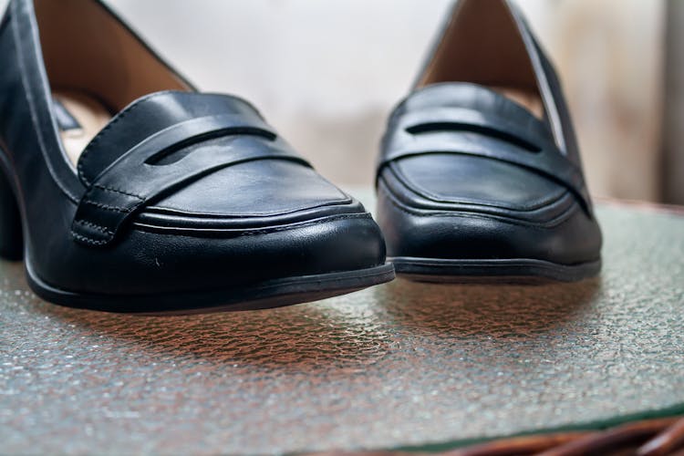 Black Leather Shoes On Glass Table