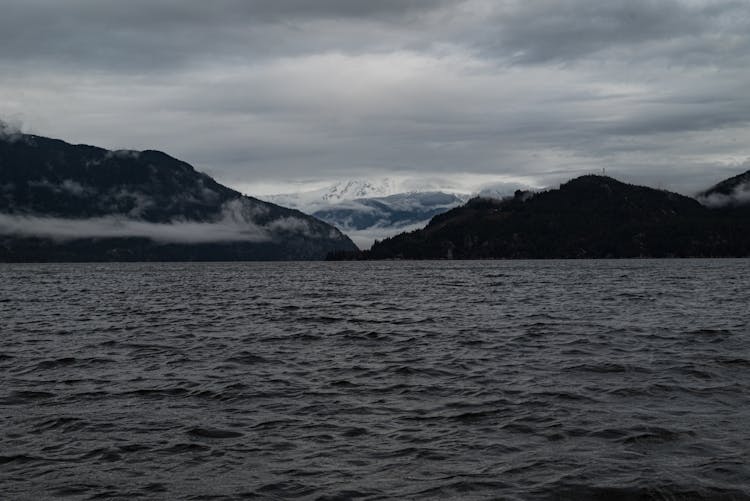 Body Of Water Near Mountains