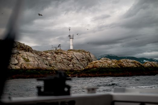 Lighthouse on a Rocky Shelf
