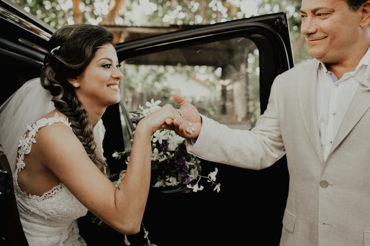 Wedding Couple Getting Out Of A Car 