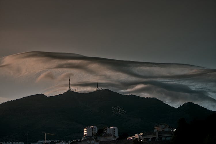 Silhouette Of Mountain Under Dark Clouds