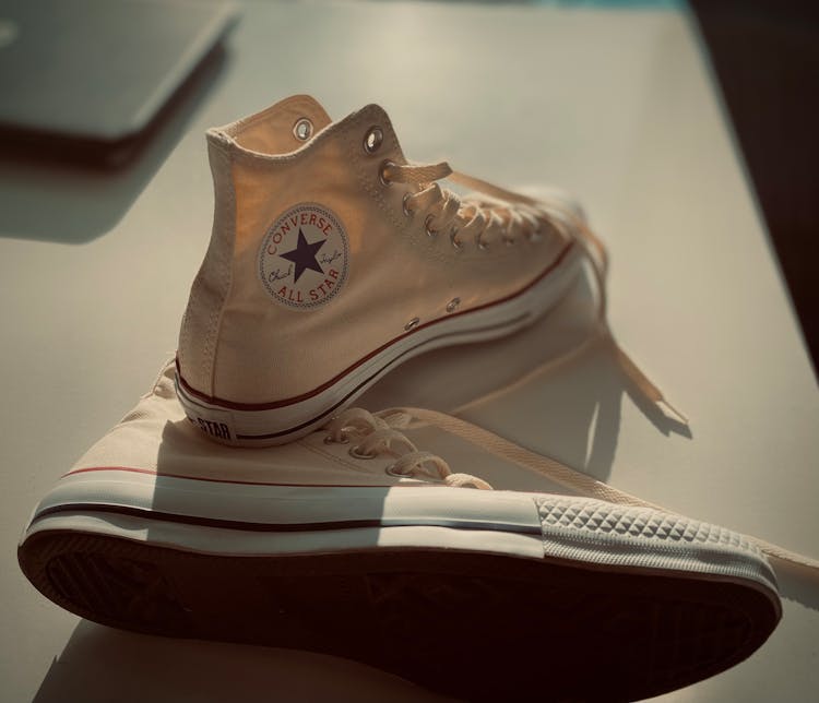 Close-up Of Sneakers On Table