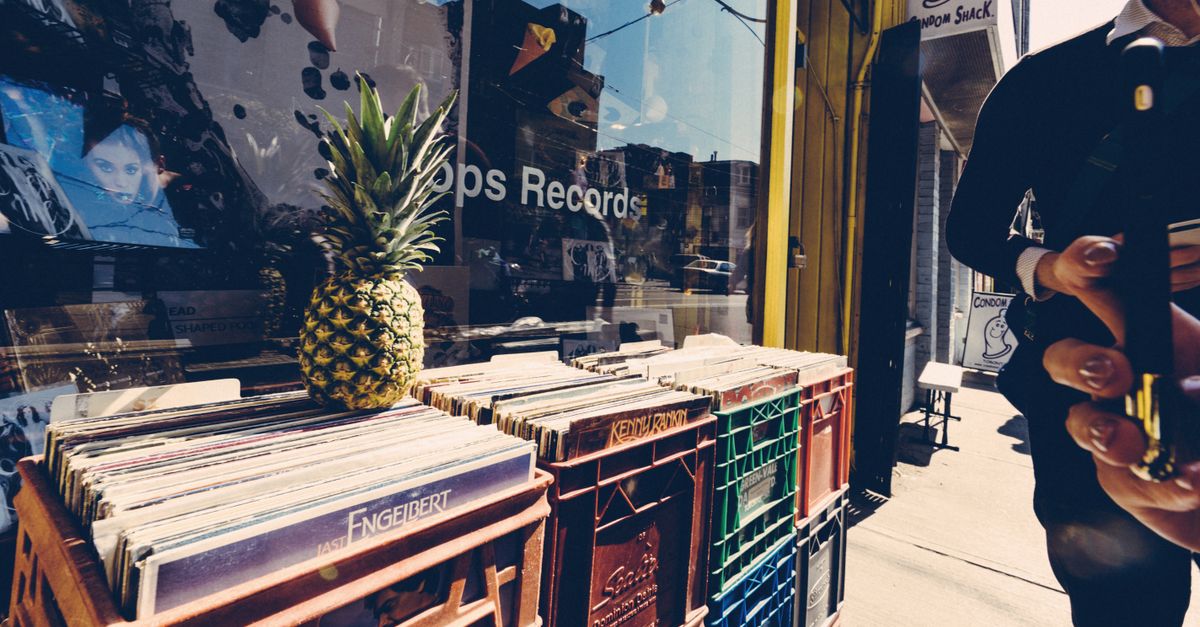 vinyl records in a dimly lit record store crate