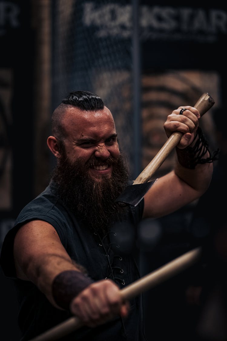 Man Looking Like Dwarf With Axes