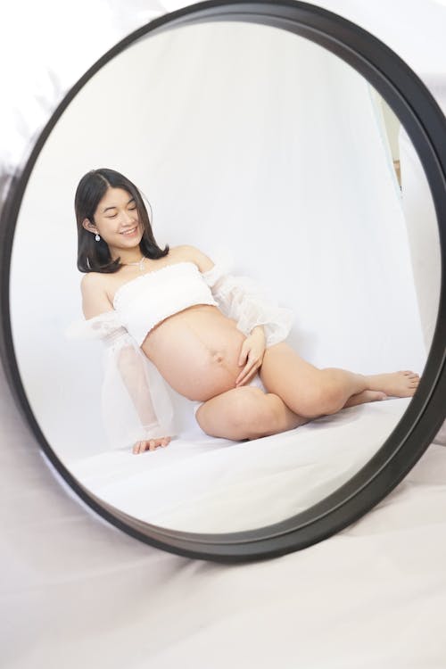 Free Reflection of a Pregnant Woman  Stock Photo