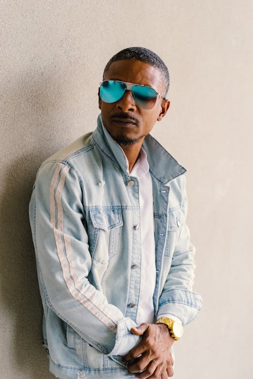 Man Wearing Denim Jacket and Sunglasses