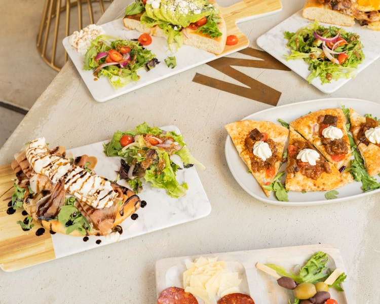 Salads And Dishes On Table