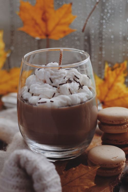 Free Warm coffee with whipped cream and macarons, surrounded by autumn leaves for a cozy vibe. Stock Photo