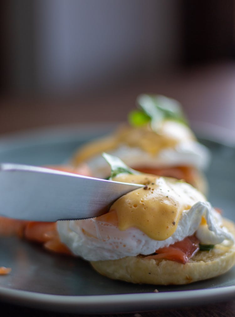 Knife Cutting Into Egg On Toast