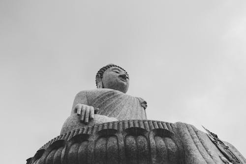 Grayscale Photo of a Buddha