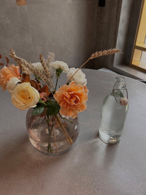 Close-Up Shot of Blooming Flowers in Glass Vase