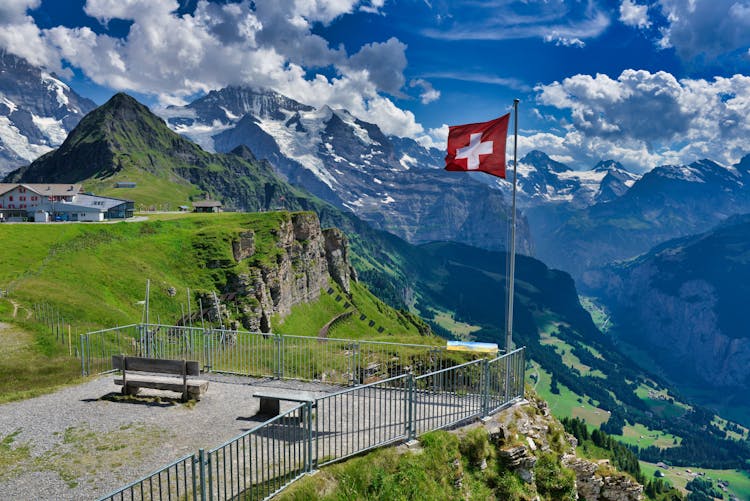 A Viewing Deck With Swiss Flag In Grindelwald, Switzerland,