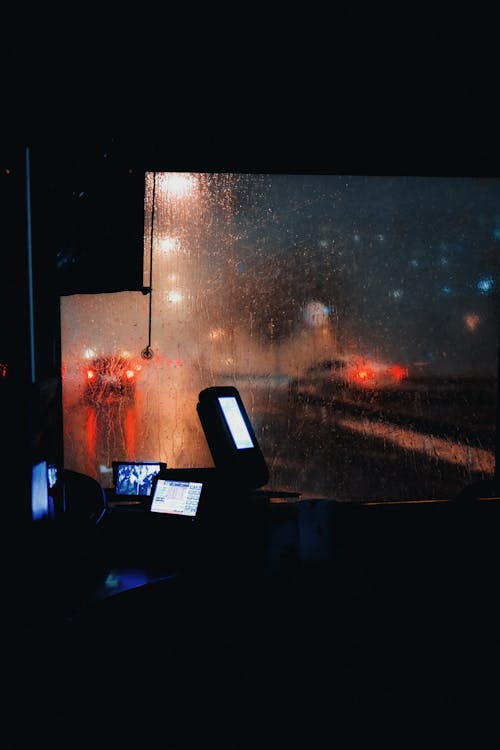 Man Driving a Bus at Night 