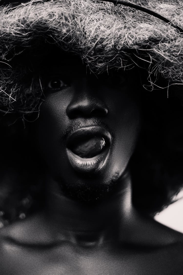 Black And White Photo Of Man Lickings His Lips