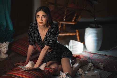 Free Photo of a Woman in a Polka Dot Top Sitting Stock Photo