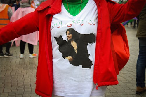 Close-up Photo of a Person wearing Printed Shirt 