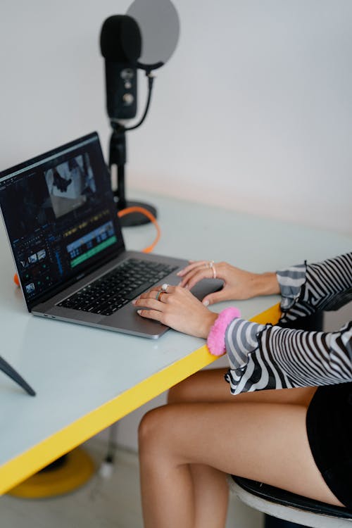 Woman Editing Photos Using Computer Software 