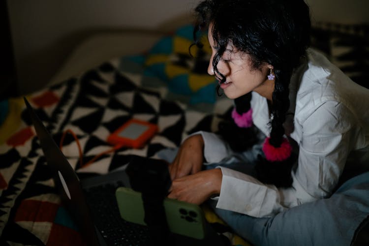 Woman With Cellphone And Laptop