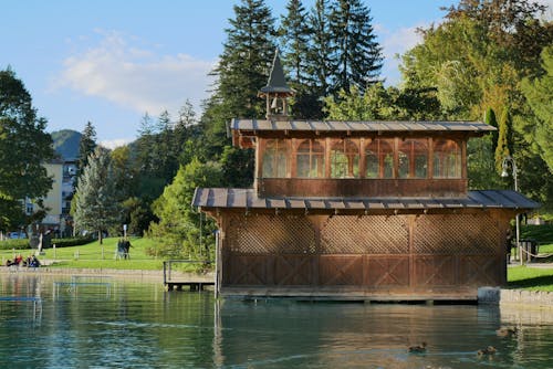 Wooden Building with Bell on Lake Bled in Summer