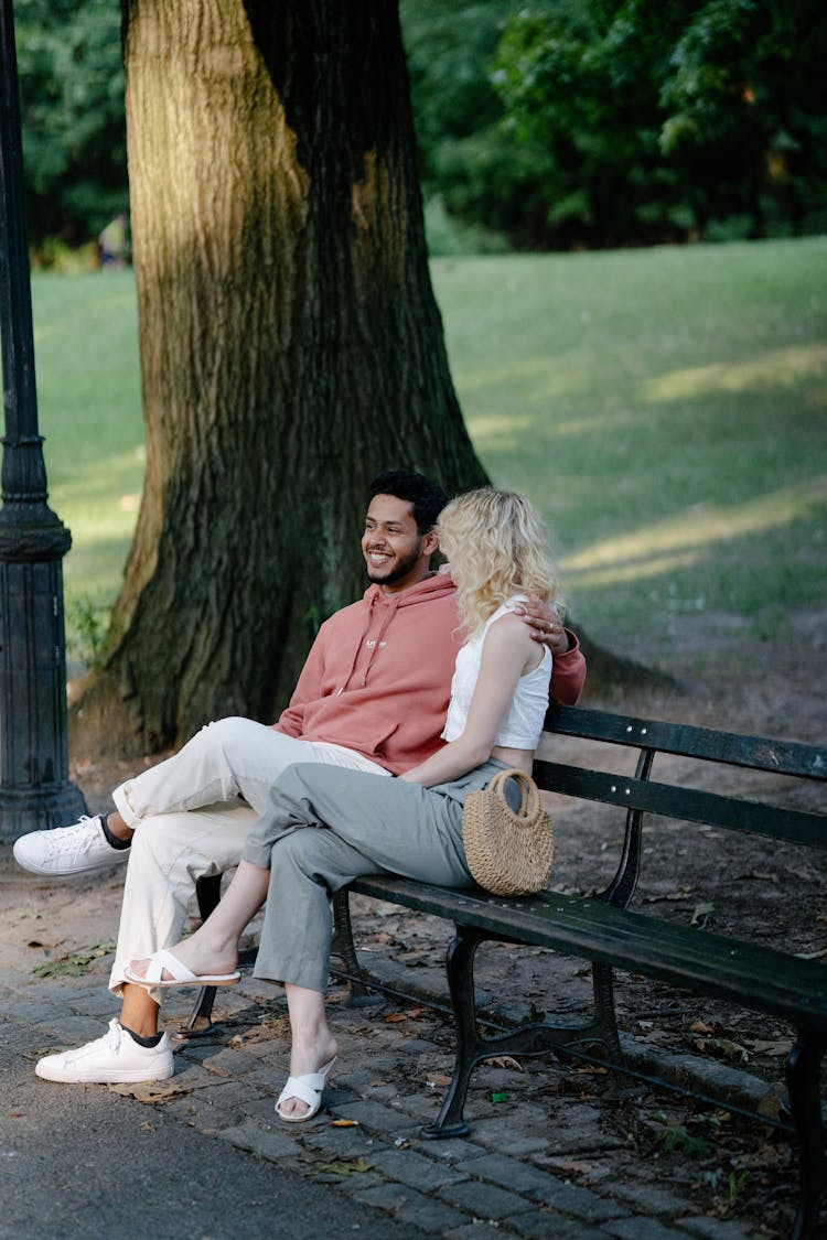 Woman And Man On Bench In Park