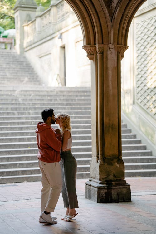 Couple Kissing near Column