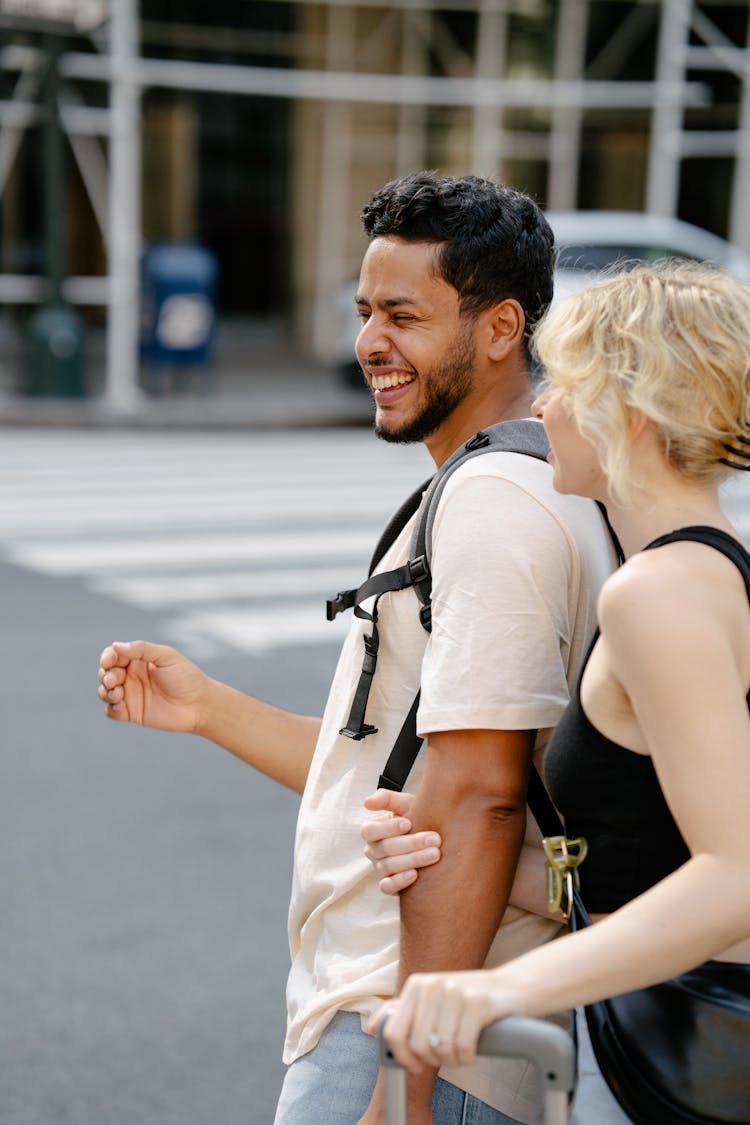 Laughing Couple Crossing A Street