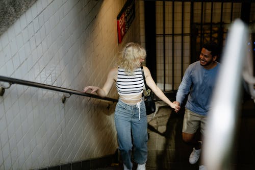 High Angle View of a Couple Coming out from an Underground Station