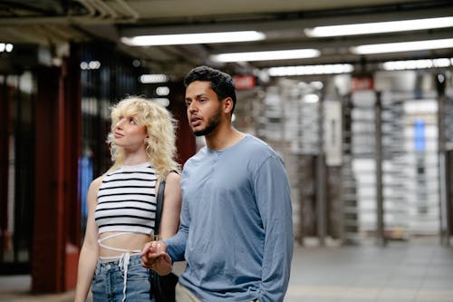 Couple at Underground Station and Ceiling Lights