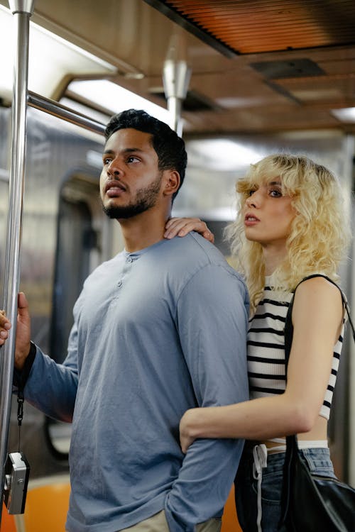 Couple Standing in a Train