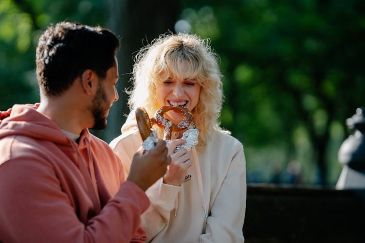 A Couple Eating Pretzels