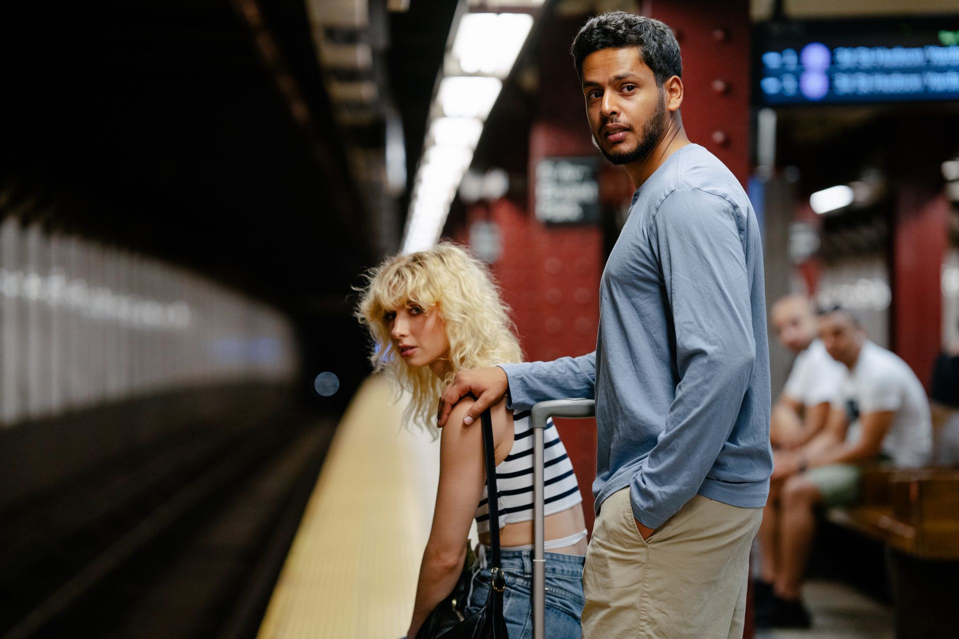 Woman and Man Waiting in Metro Station