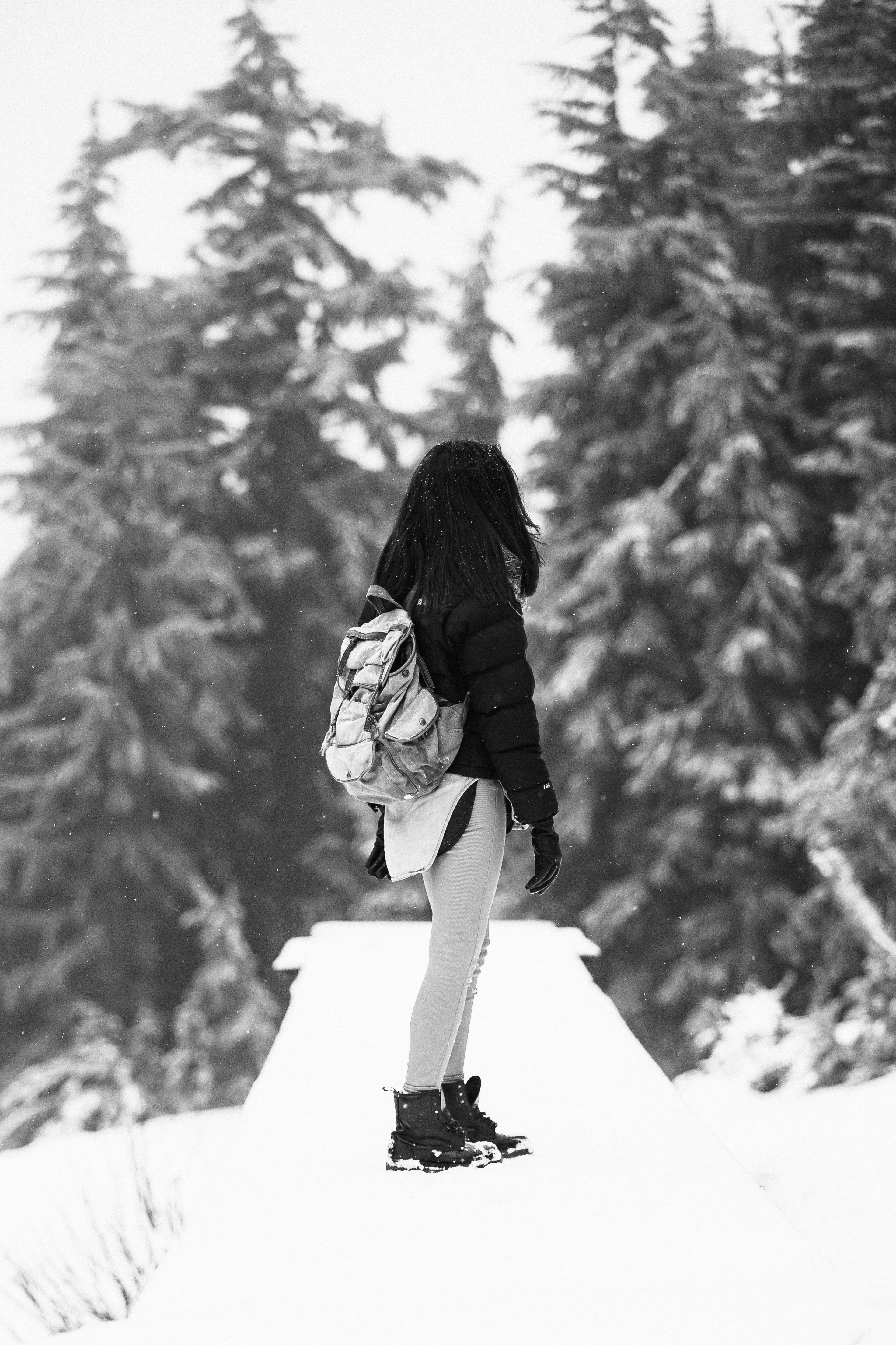 Prescription Goggle Inserts - A woman in winter attire hiking through the snowy wilderness of Mount Hood, Oregon.