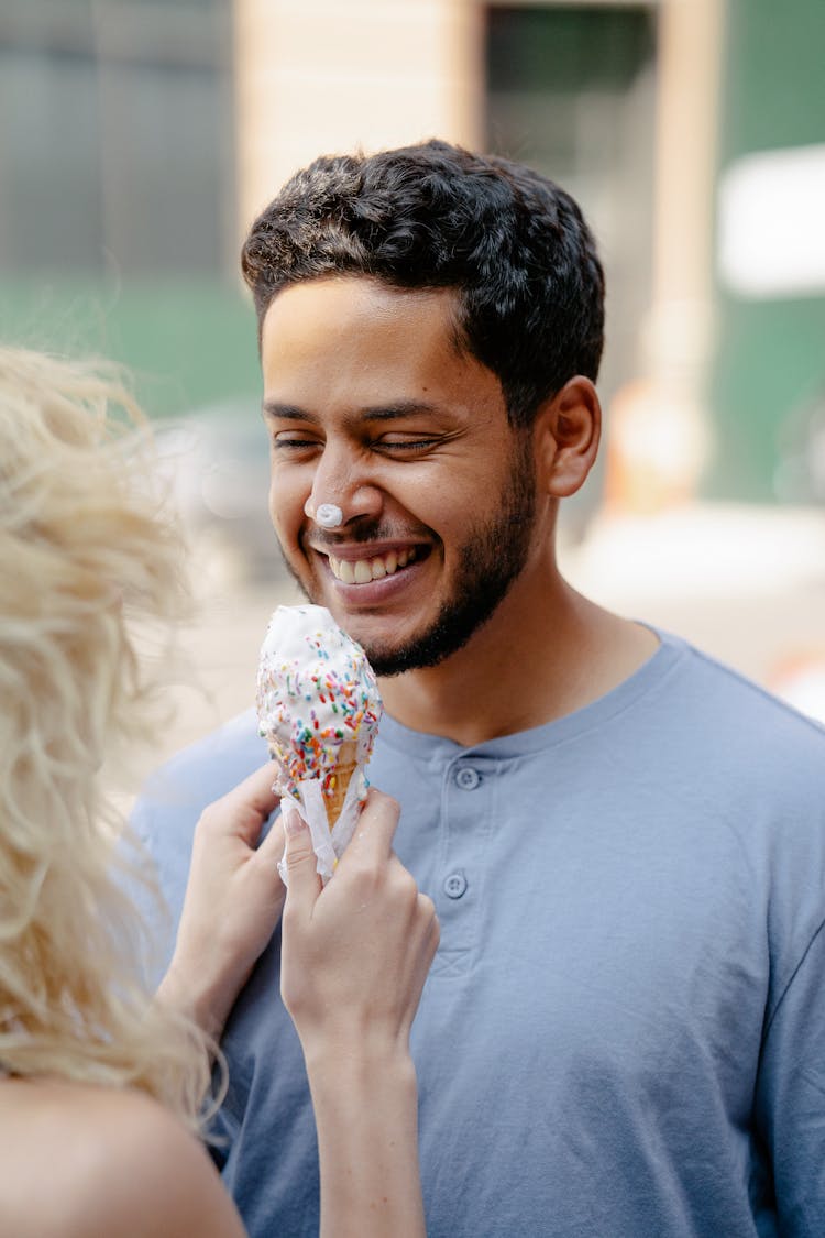 Woman And Man With Ice Cream On Nose