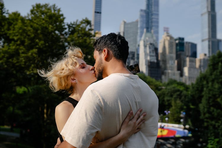 Couple Kissing In Park